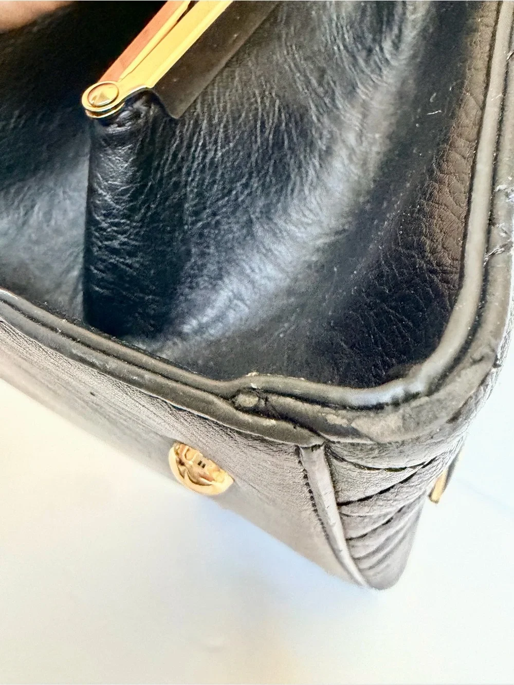 Black Quilted Leather Top-Handle Bag with Gold Trim
